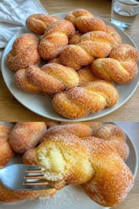 Gebackene Zimtschnecken aus frischem Teig mit Zimt und Zucker