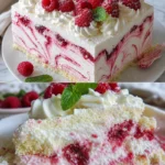 Himbeer-Wirbel-Käsekuchen mit frischem Himbeertopping auf einem Teller