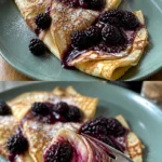 Zarte Pfannkuchen mit schwarzen Johannisbeeren auf einem Teller serviert
