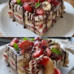 Erdbeer-Stracciatella-Bananen-Torte auf einem Teller, dekoriert mit frischen Erdbeeren.